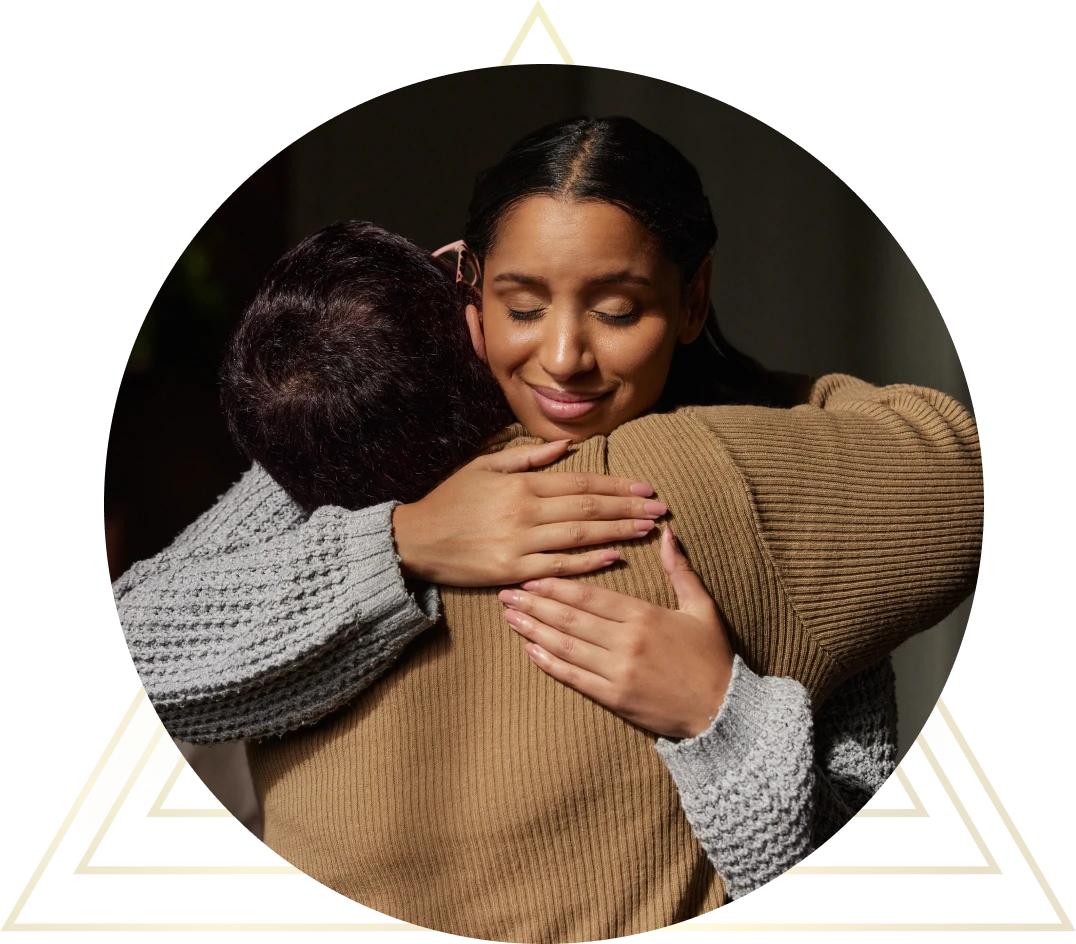 People hugging warmly and smiling