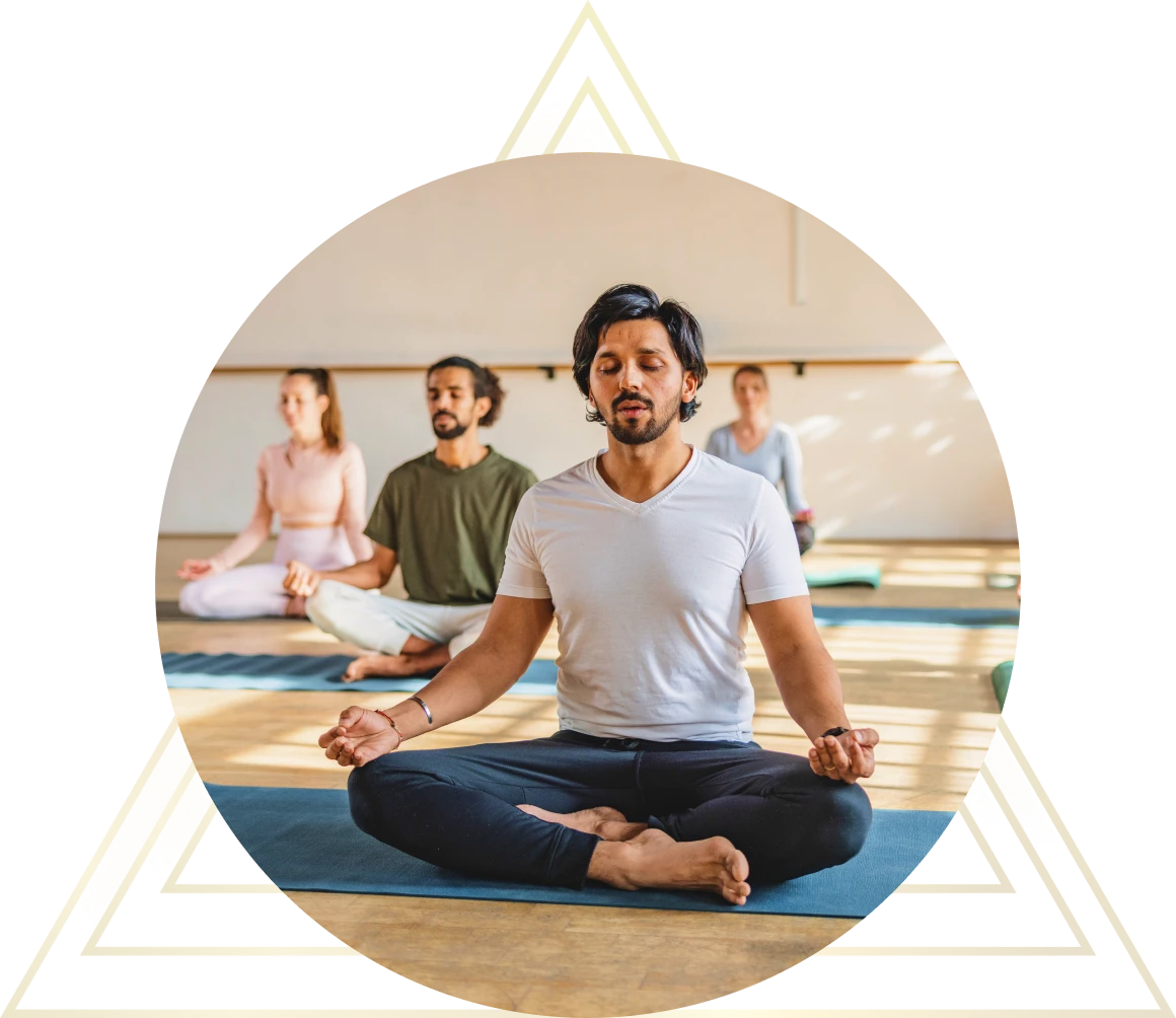 People practicing meditation on mats