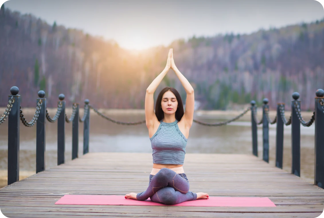 Serene yoga pose by a tranquil lake